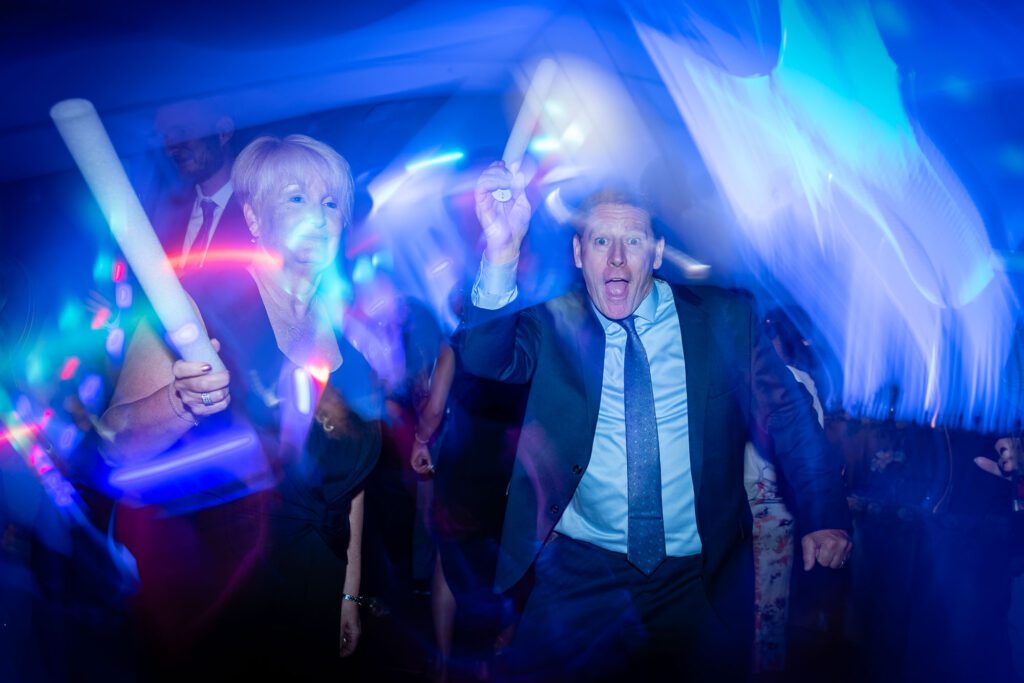 reception at a wedding with glow sticks